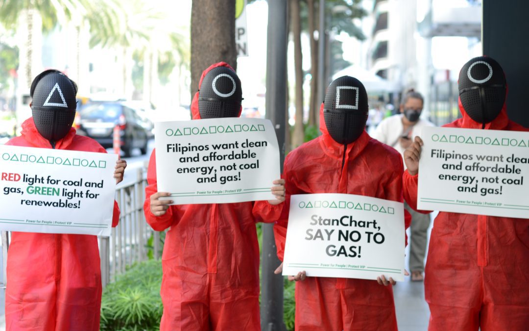 Activists stage protest against Standard Chartered Bank’s fossil fuel financing