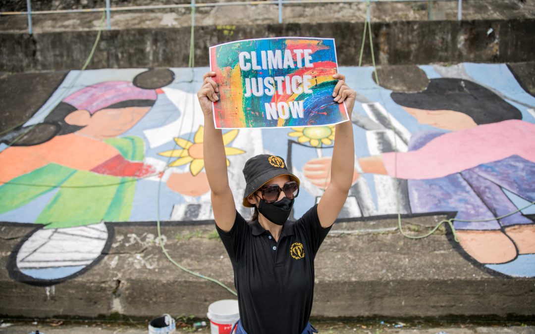 Artists, youth groups demand climate justice through street art as COP26 opens